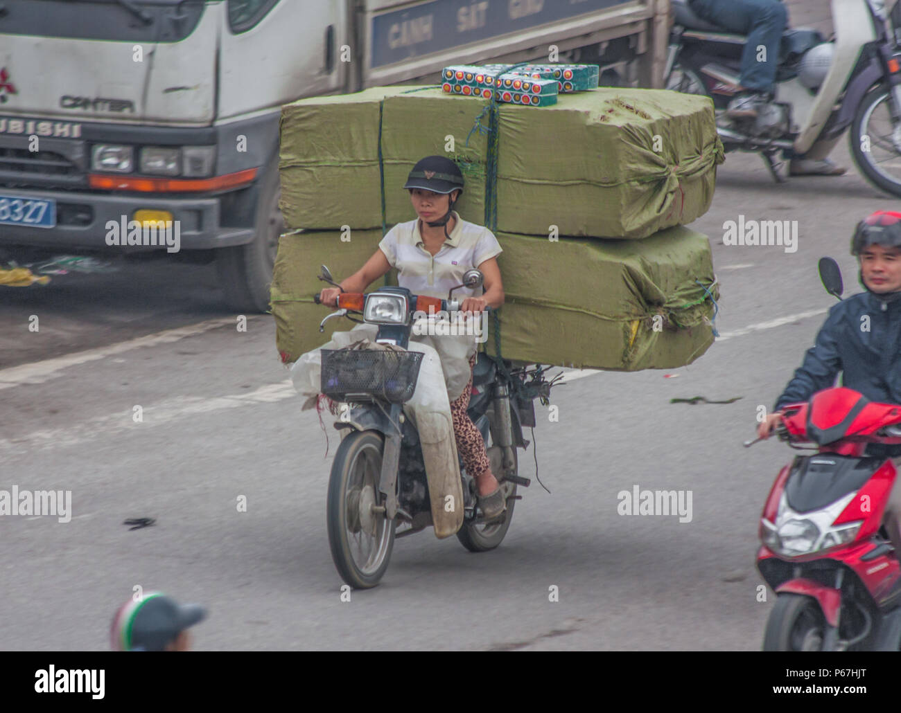Hanoi, Vietnam since cars are expensive and the traffic crazy, in