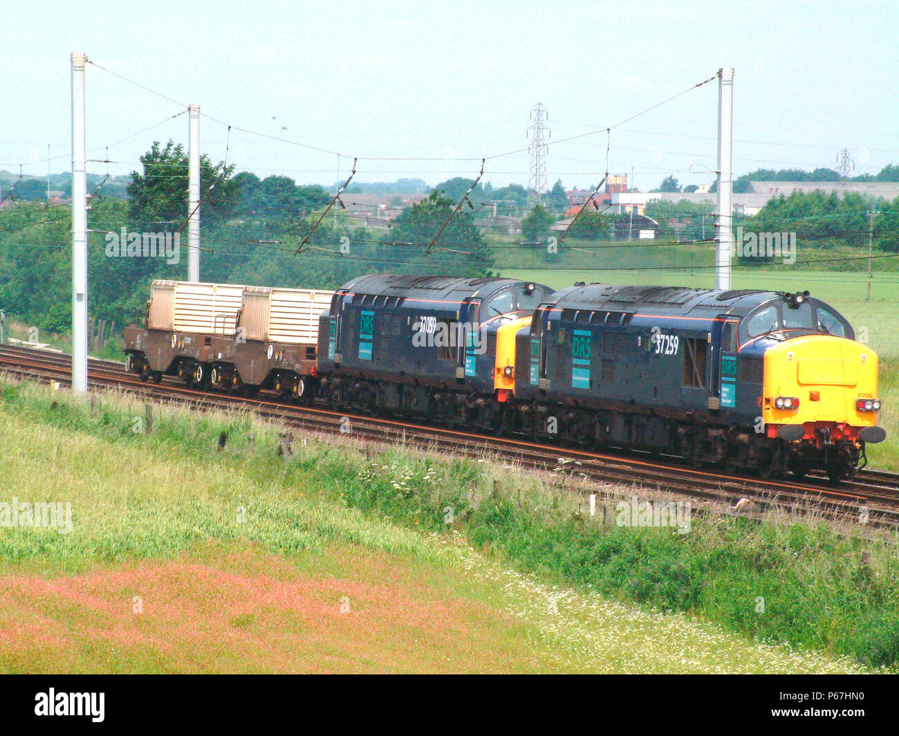 The nuclear facility at Sellafield generates a number of rail services powered by multiple locomotives such as this pair of Class 37 locomotives noted Stock Photo