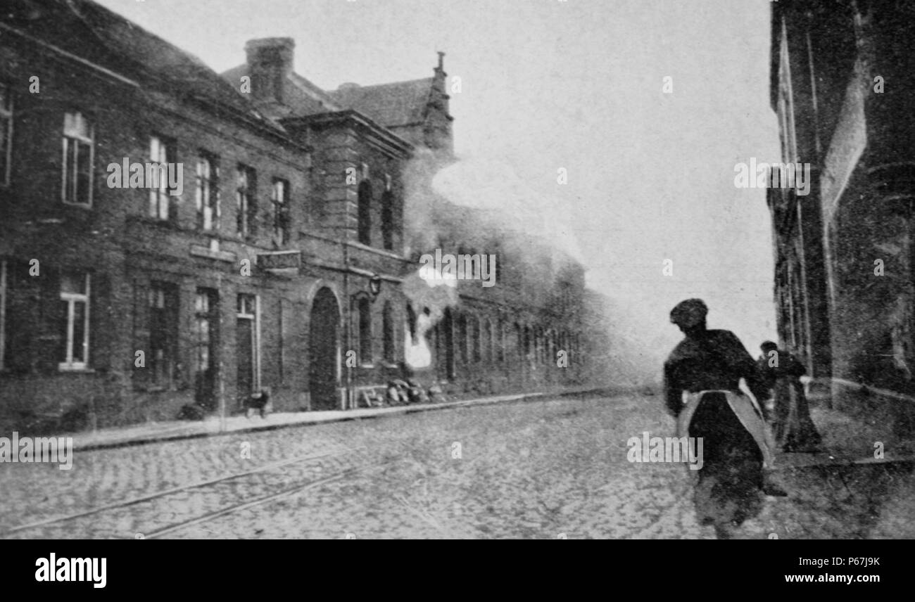French civilians run as their town is shelled by German artillery. 1915 World war one Stock Photo