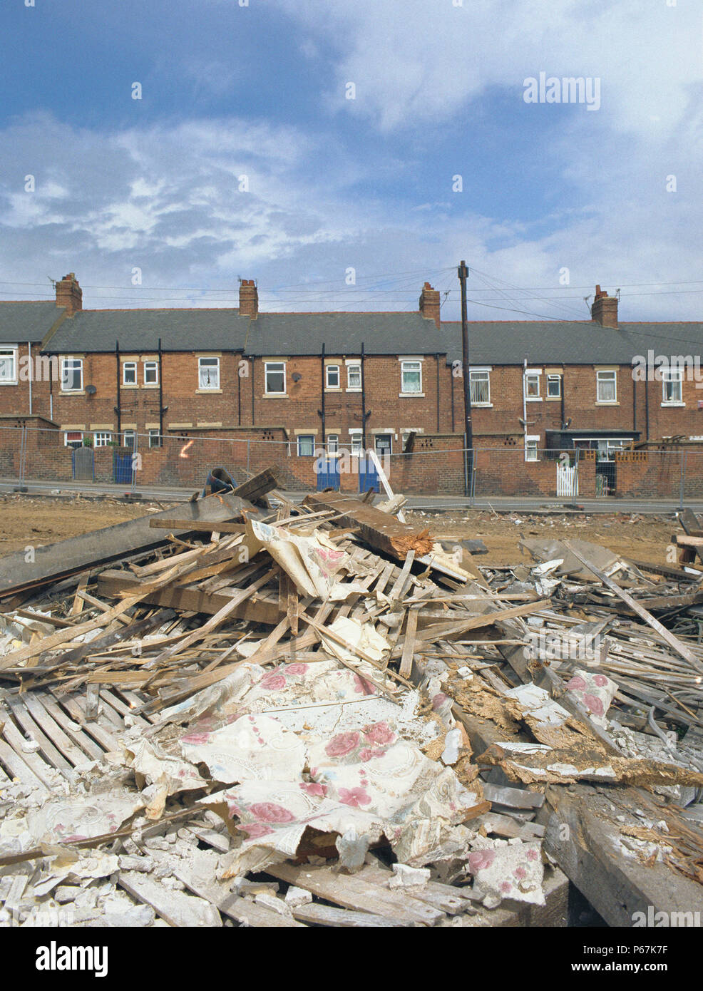 Pile of rubbish in front of council houses in Yorkshire Stock Photo Alamy