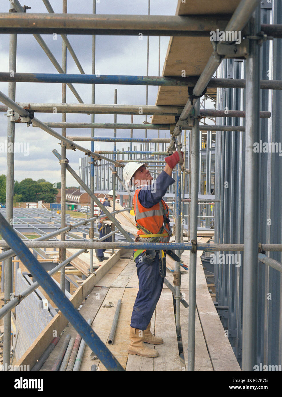 Scaffolding being erected on a building site Stock Photo Alamy