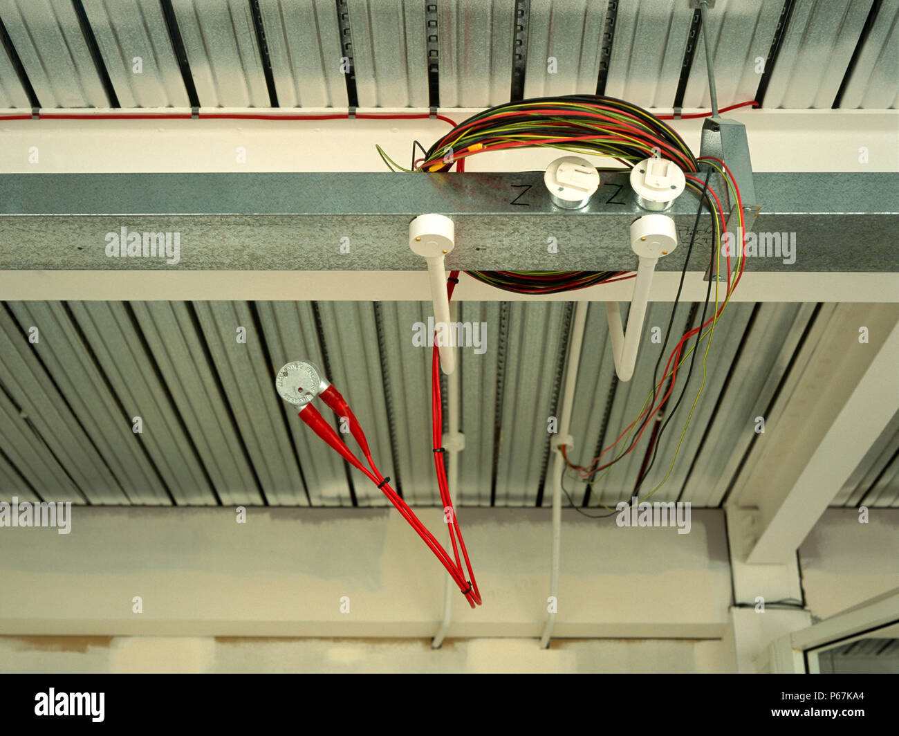Electrical wires hanging out, office space in shell condition Stock Photo
