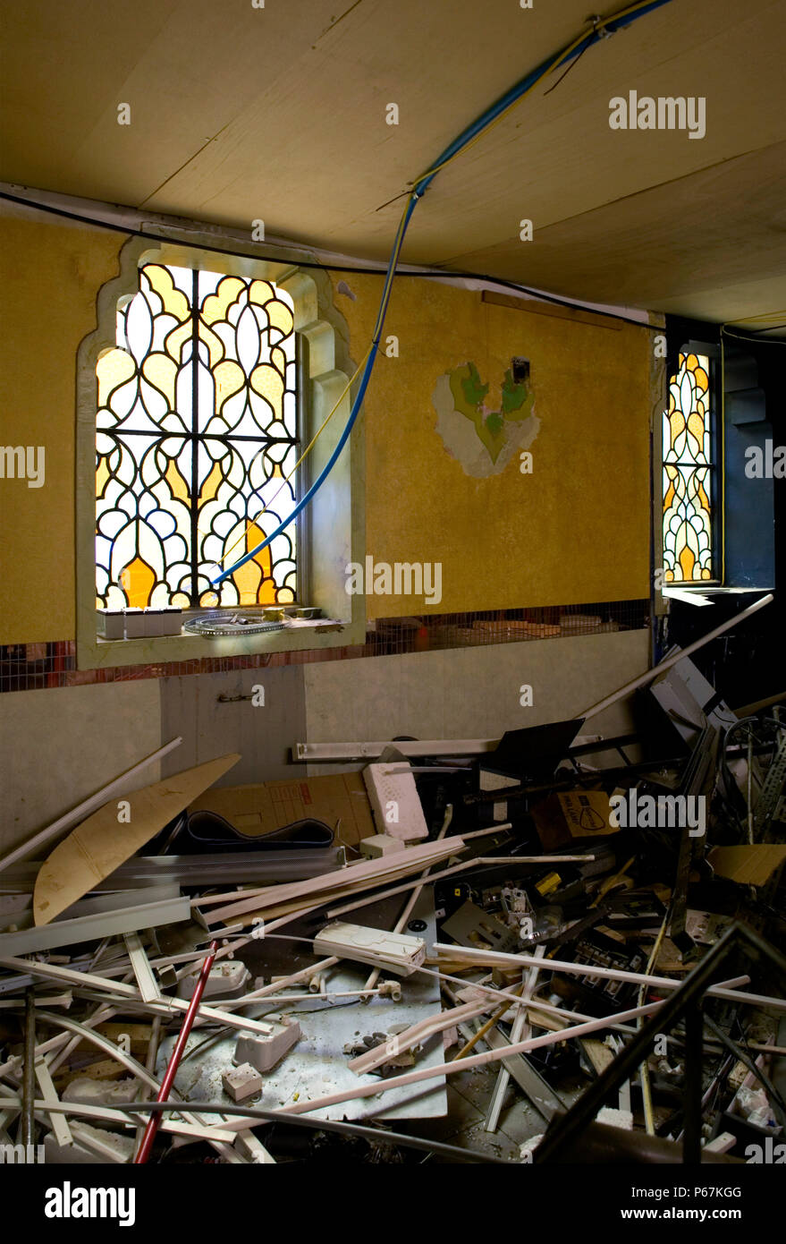 Demolition of old house with stained galss window Stock Photo