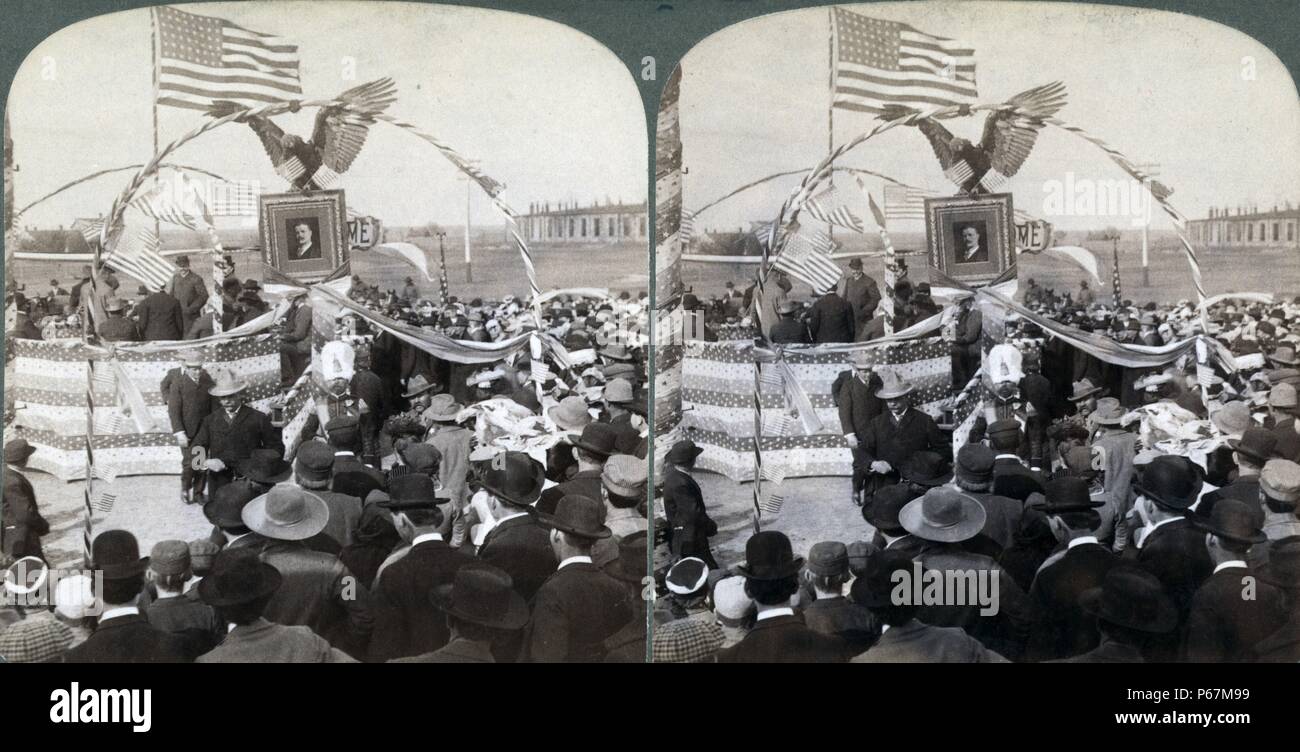On President Roosevelt's journey throught the west - splendid reception at Ellis, Kansas' Photograph showing Roosevelt standing on platform decorated with his portrait, an eagle, and flags. Theodore Roosevelt (1858 – 1919) was an American politician, author, naturalist, explorer, and historian who served as the 26th President of the United States. Stock Photo