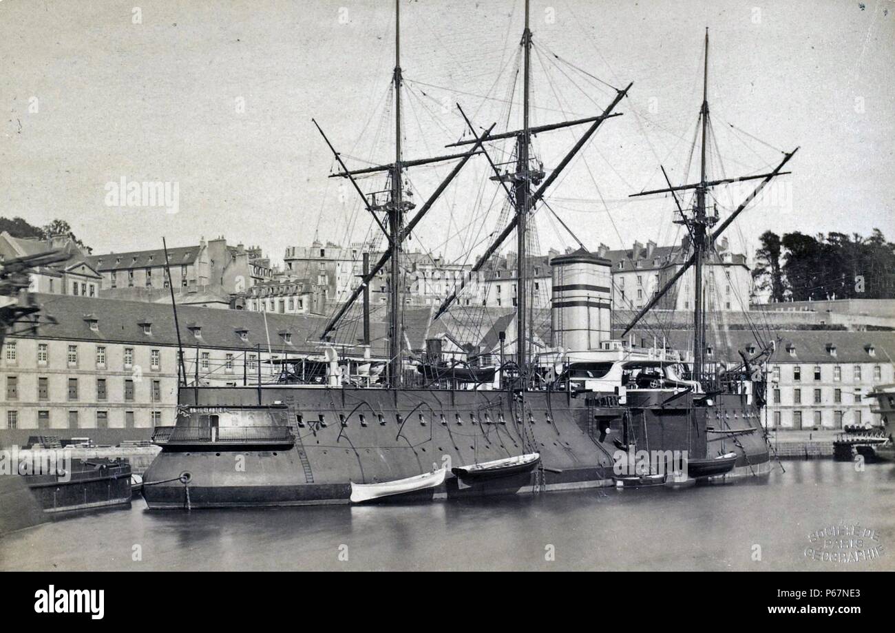 The Redoubtable in port in Brest, 1882. The Redoutable was the first warship to use steel as its primary construction material, although parts of it still consisted of wrought iron. The ship was launched in 1876 and would go on to serve until 1910. She was armed with seven breechloading 27 centimeter cannons, six breechloading guns of 14 centimeters, and some Hotchkiss revolving guns. She spent most of her career in the French mediterranean fleet, but was present in the 1901 negotiations that followed the Boxer Rebellion in China. Stock Photo