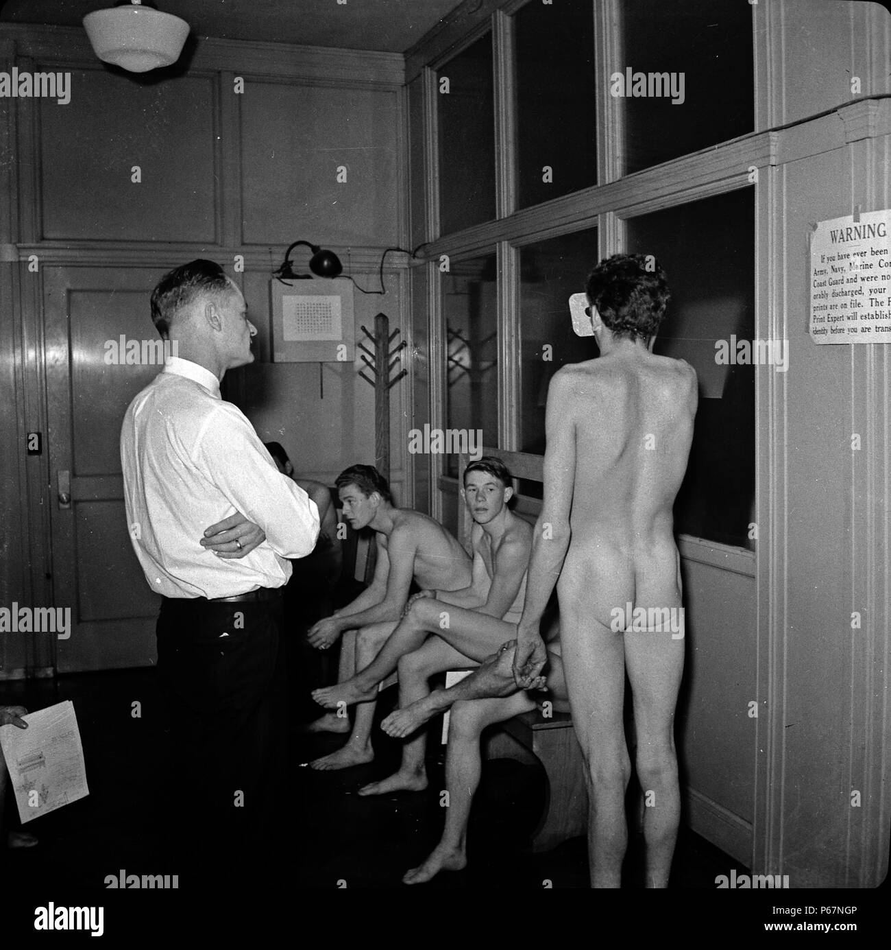 Image shows the Enlisting in the Marines, the recruits undergoing a medical and physical examination. San Francisco, California, taken in 1941. Stock Photo