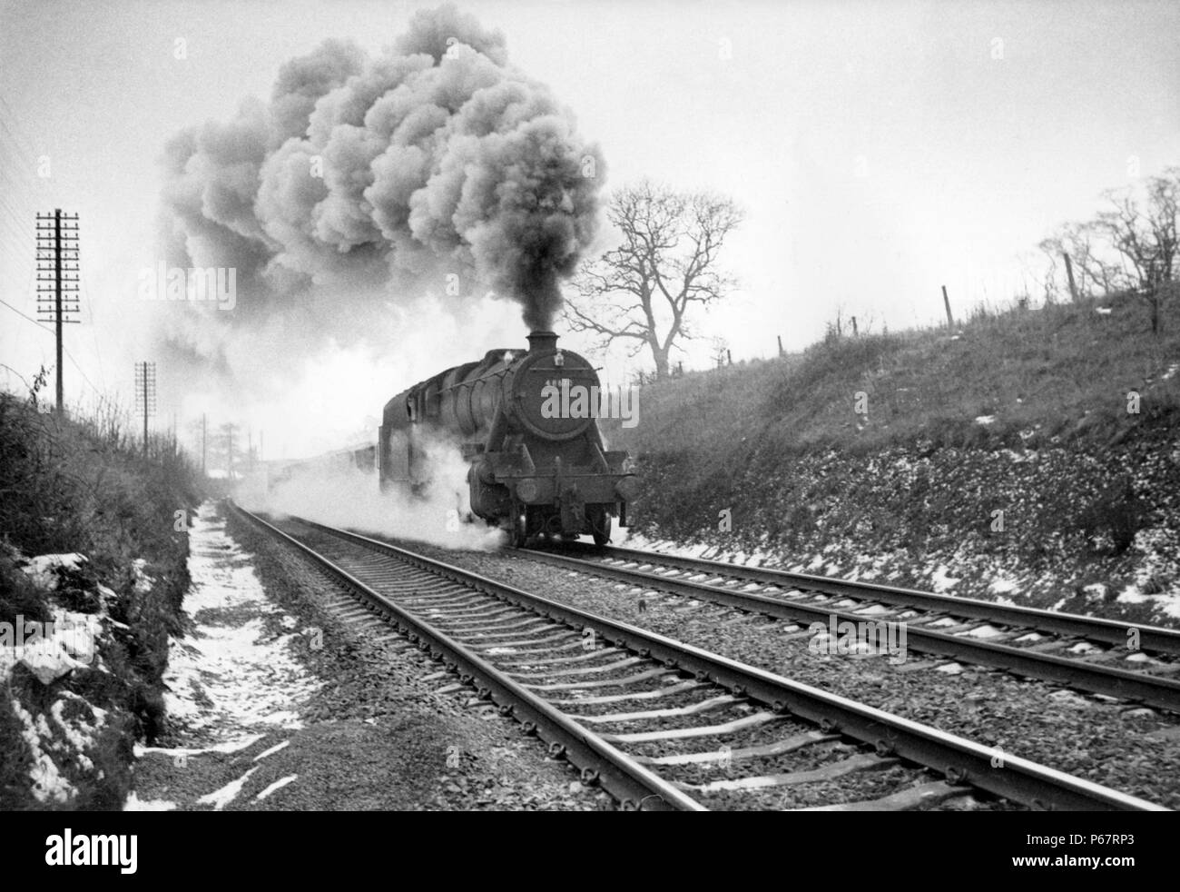 One of the last steam workings on the Midland Main Line was the 14:35 goods from Leicester to Wellingborough. The train is seen here approaching Milep Stock Photo