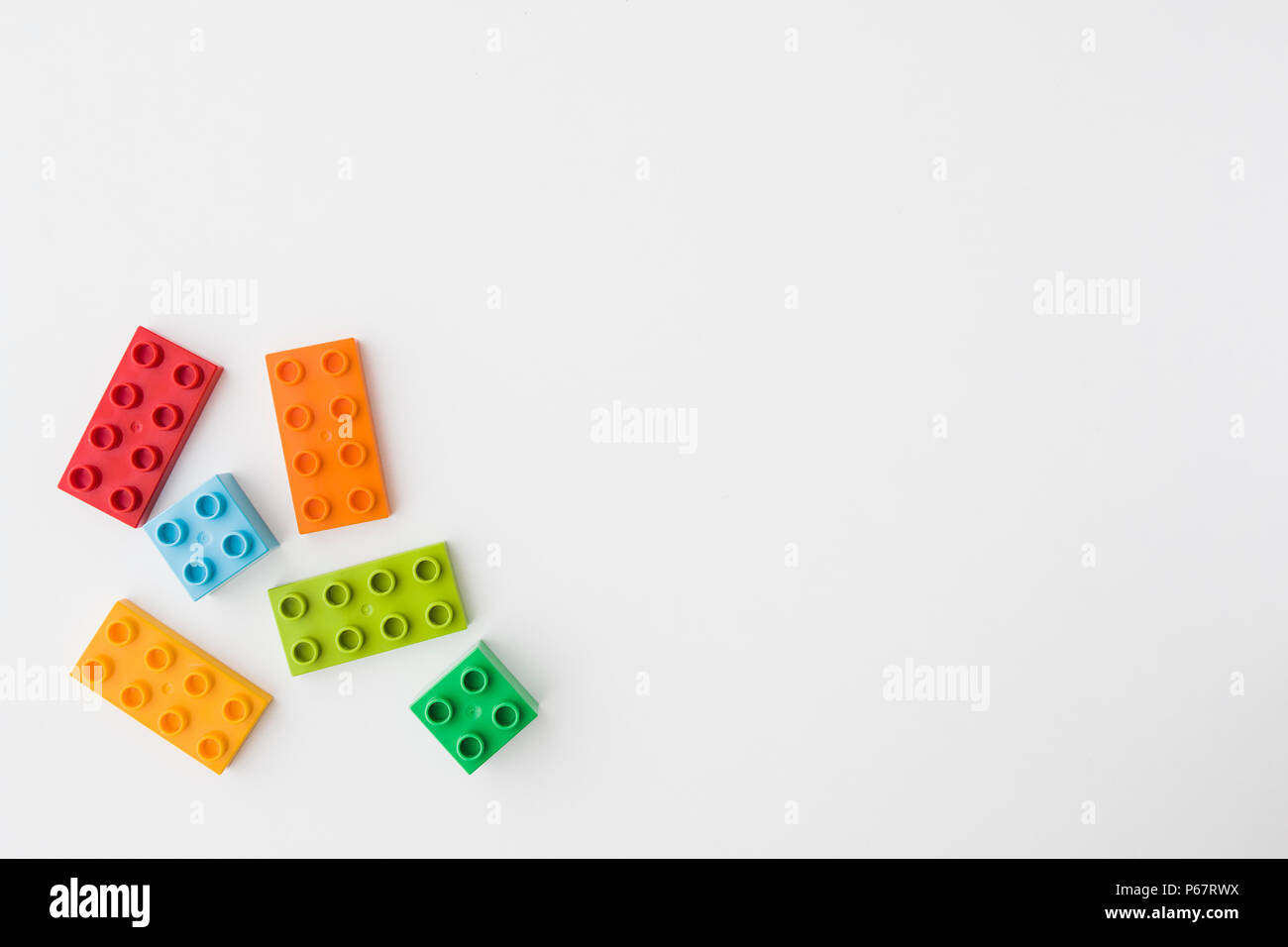 toy bricks of assorted colors on white background Stock Photo