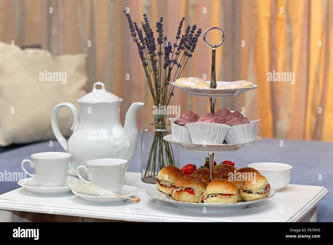 Afternoon tea with sandwiches and cakes Stock Photo - Alamy