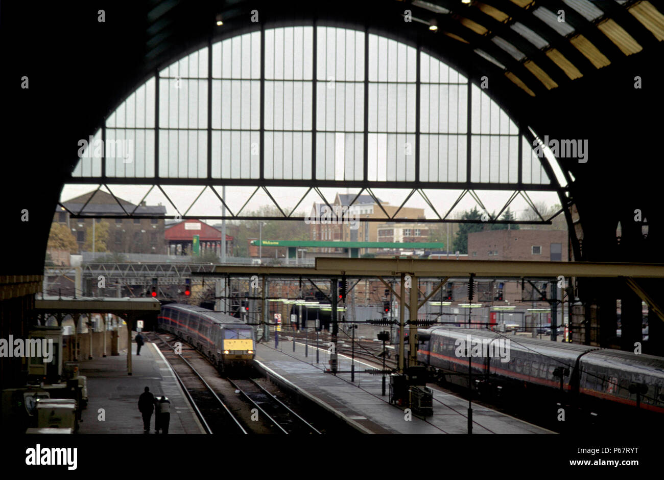 Overview of the trainshed at London's Kings Cross station with a train entering at the end of its journey from the north. Stock Photo
