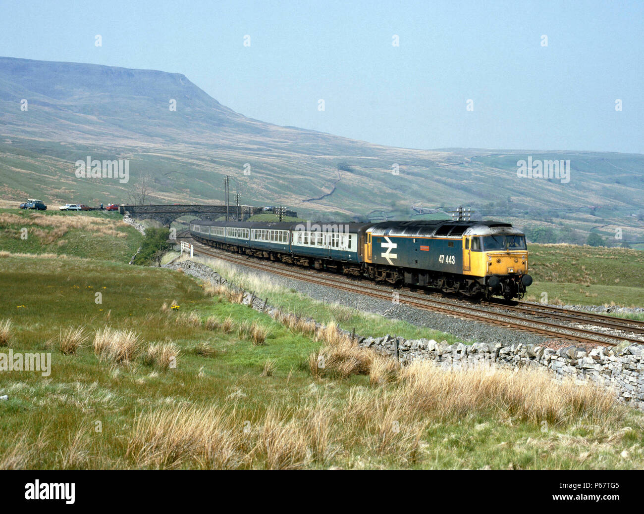 Settle and Carlisle line. No.47.443 at Ais Gill Summit with the 12:42 ex Carlisle for Leeds. 20.05.1989. Stock Photo
