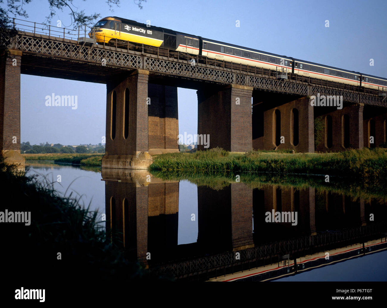 Shambrook Viaduct crossing the River Ouse in Bedfordshire with an Inter City liveried 125 High Speed Train heading an afternoon service northwards alo Stock Photo