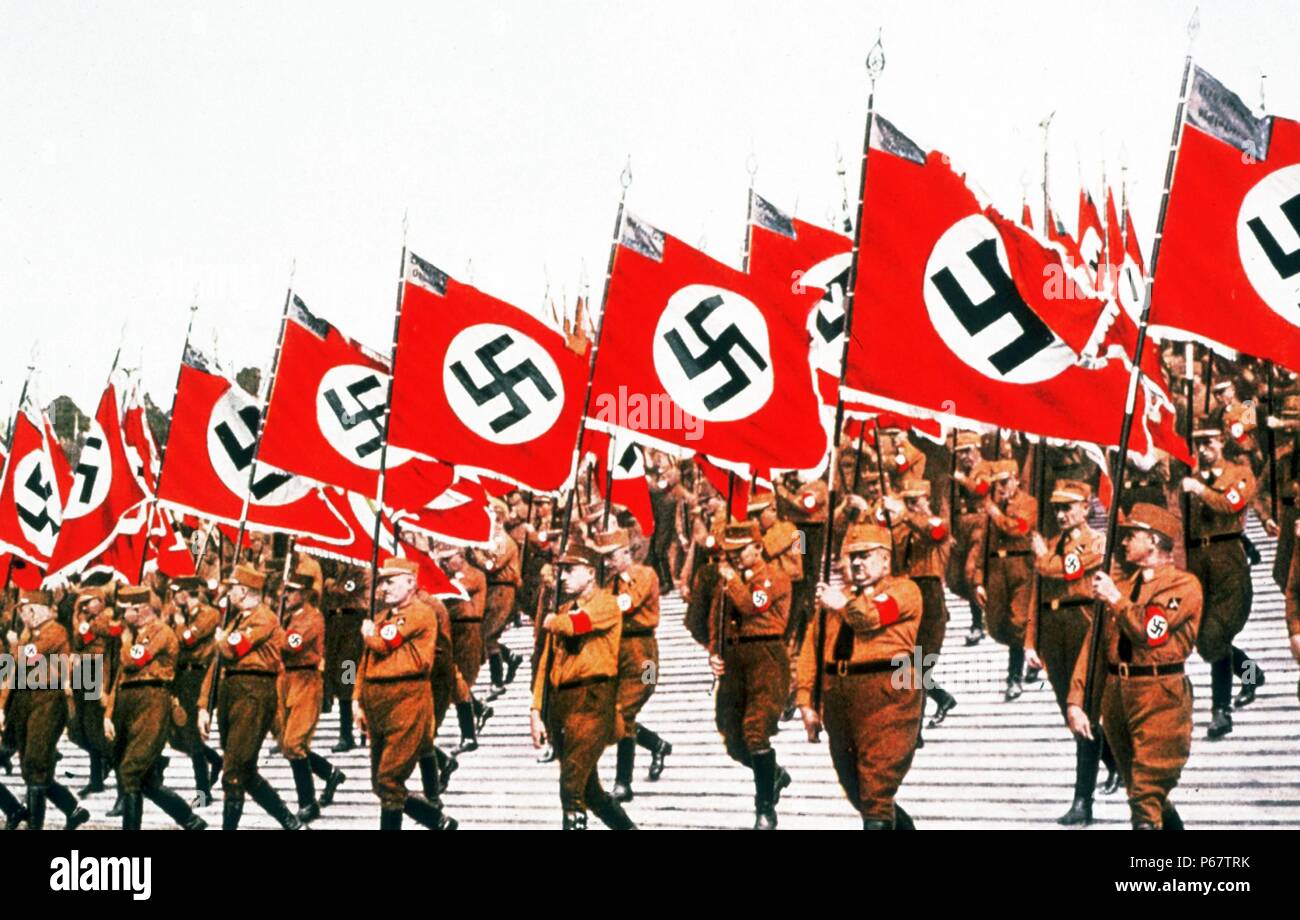 The entry of the colours at the German National Socialist Party Day at Nuremberg, 1933. The National Socialist German Workers' Party commonly known in English as the Nazi Party, was a political party in Germany active between 1920 and 1945. Stock Photo