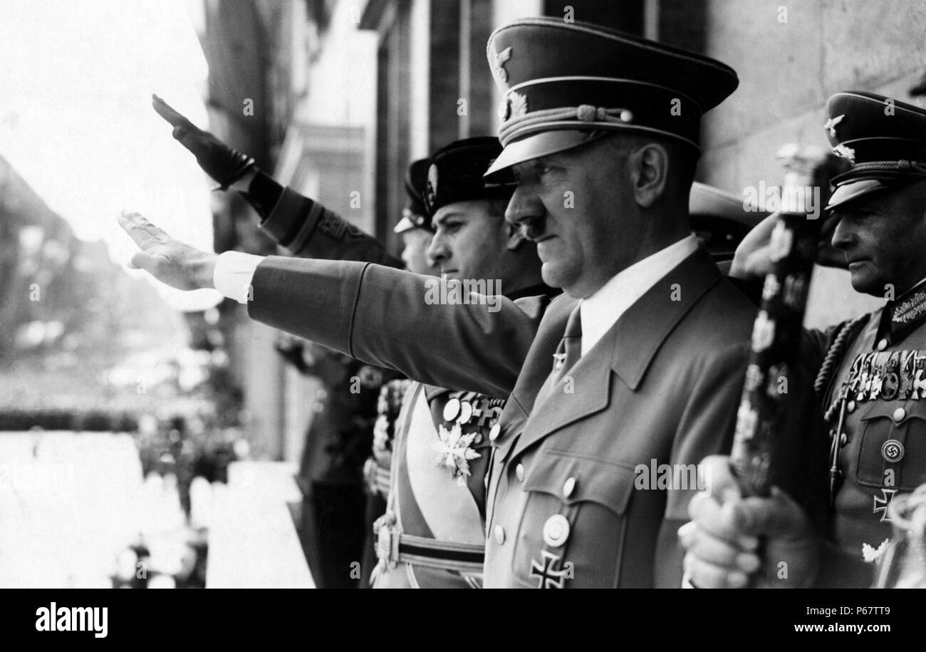 Adolf Hitler and Count Ciano salute on a chancellory balcony in Berlin. Hitler was chancellor of Germany from 1933 to 1945 and dictator of Nazi Germany from 1934 to 1945. Hitler was at the centre of Nazi Germany, World War II in Europe, and the Holocaust. Stock Photo
