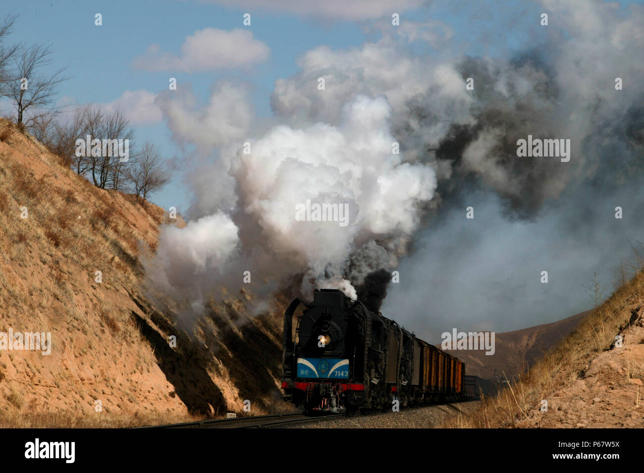 The cutting west of Liudigou Station on the Jing Peng section of the Ji-Tong Railway Inner Mongolia is a superb location for east bound freights climb Stock Photo