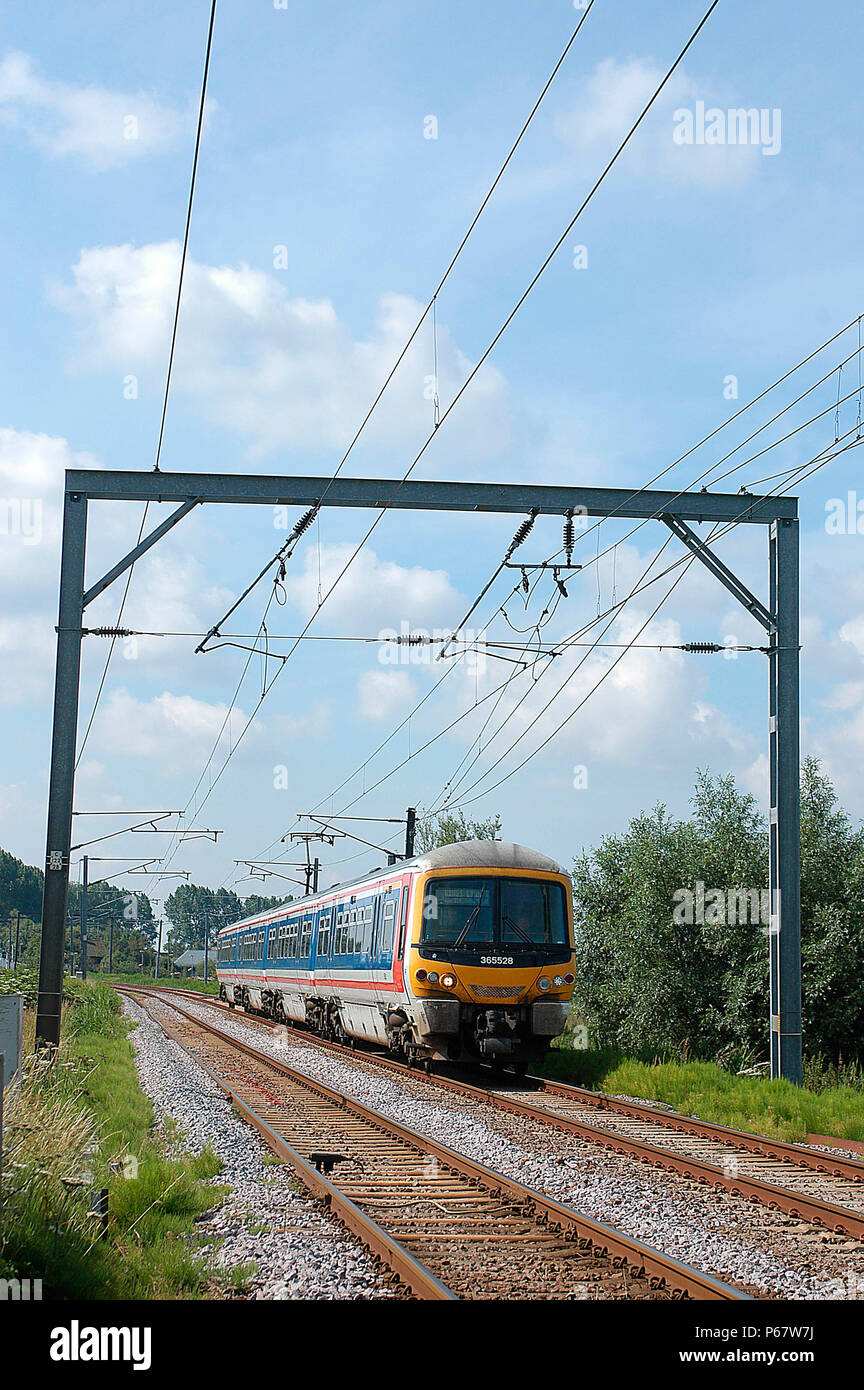 The electrified service between Kings Cross and Kings Lynn uses Networker EMU sets that still the retain original Network South East livery from the 1 Stock Photo