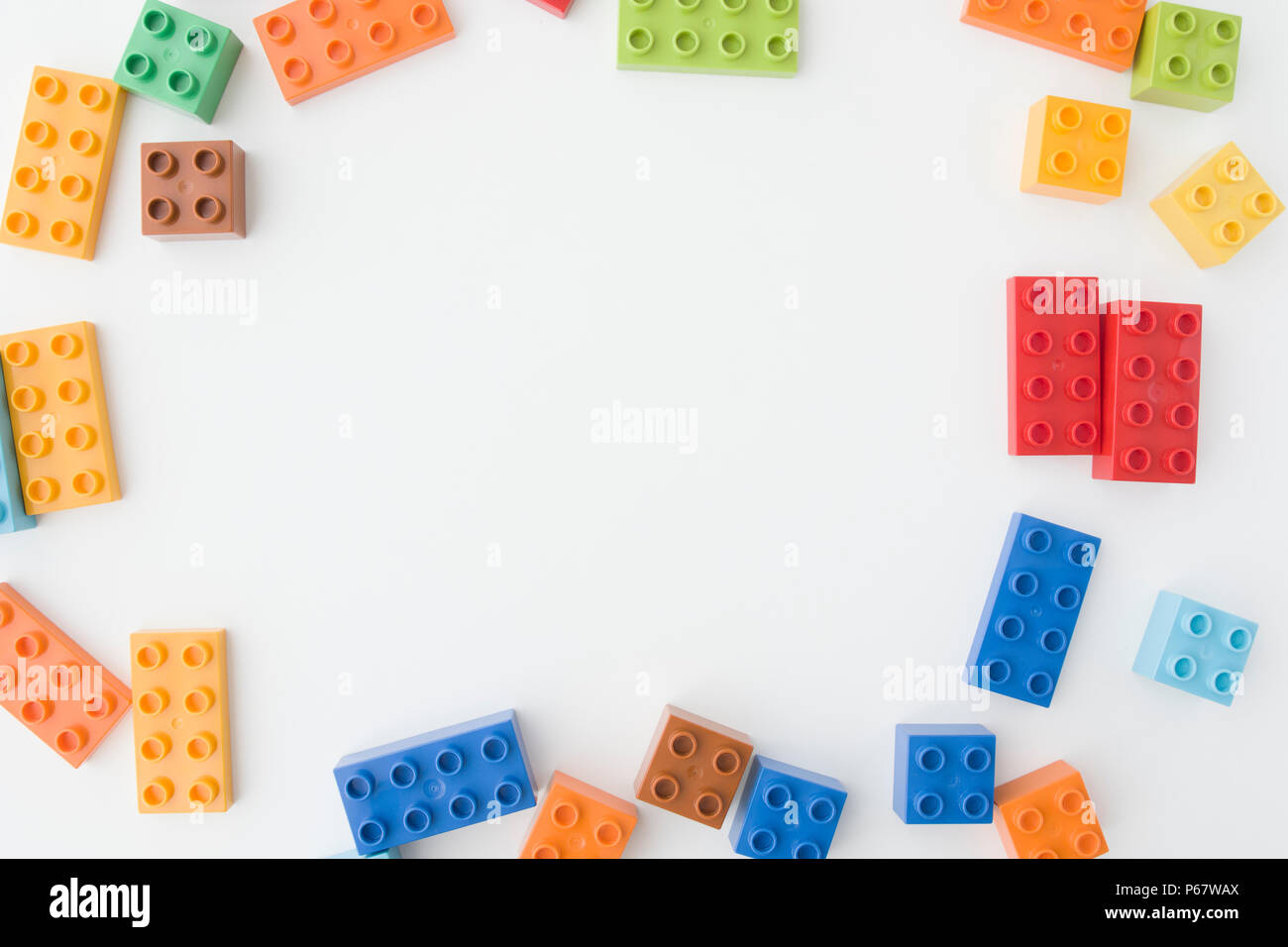toy bricks of assorted colors on white background Stock Photo