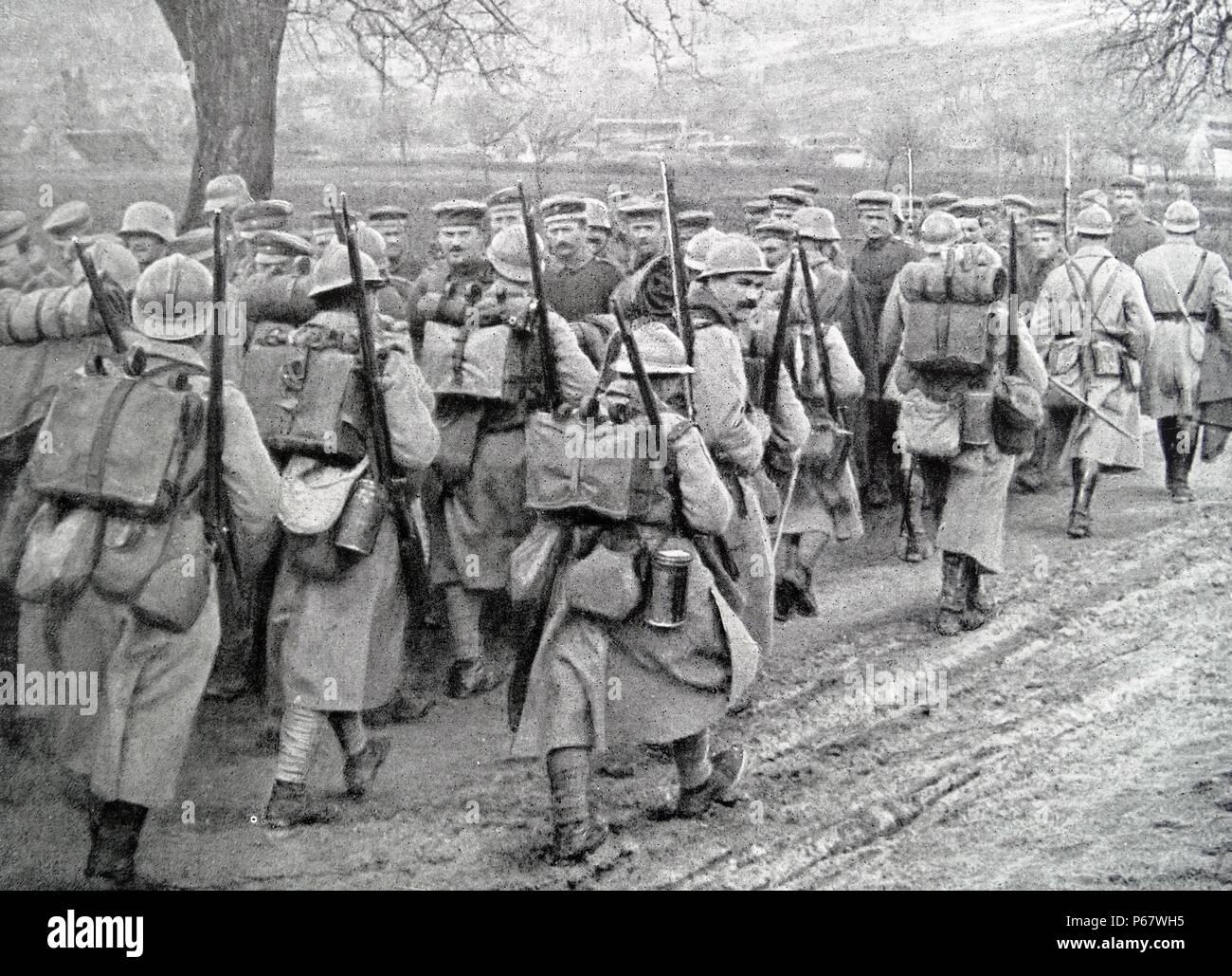 French infantry group passes by German prisoners of war during World
