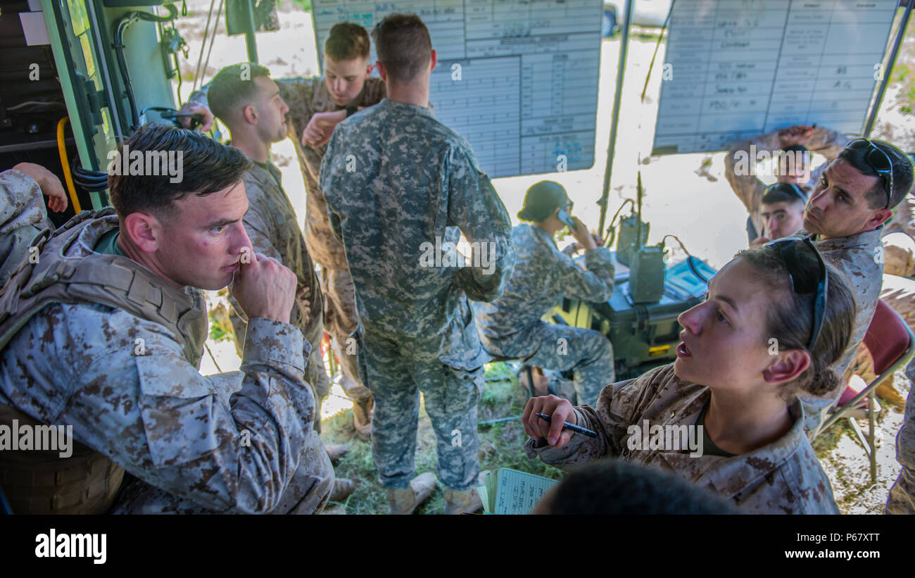 Second Lt. Katherine Boy, right, leads a fire direction center at the