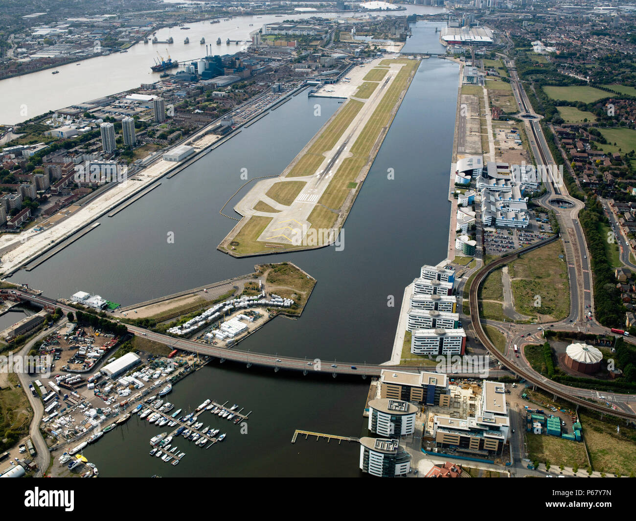 Aerial view City Airport from the east. Old Royal Docks, University of East London, Thames Barrier,Excel Stock Photo
