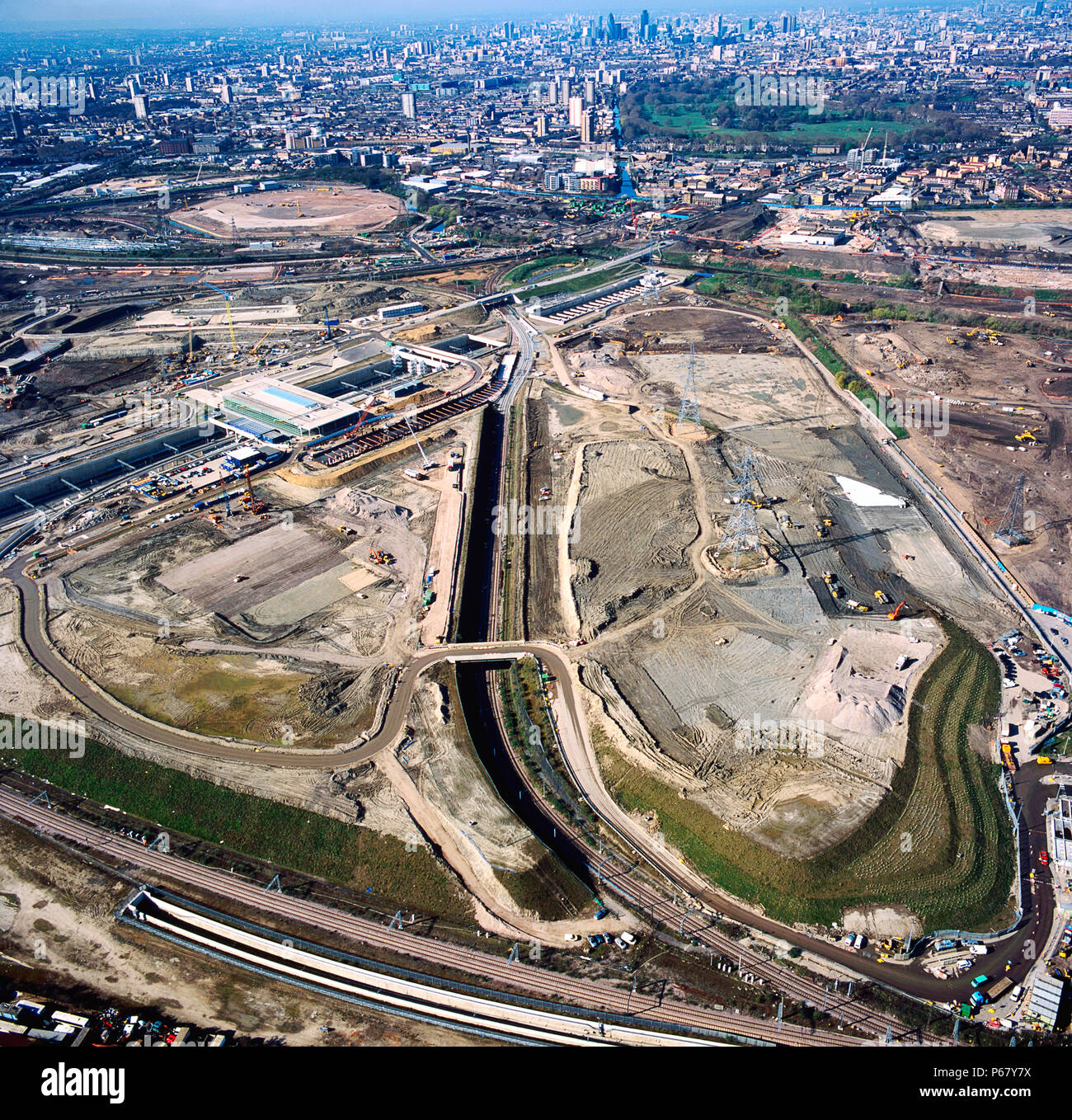 Aerial view from north over Olympic site and works to Stratford International Station to Victoria Park and the City of London, UK Stock Photo