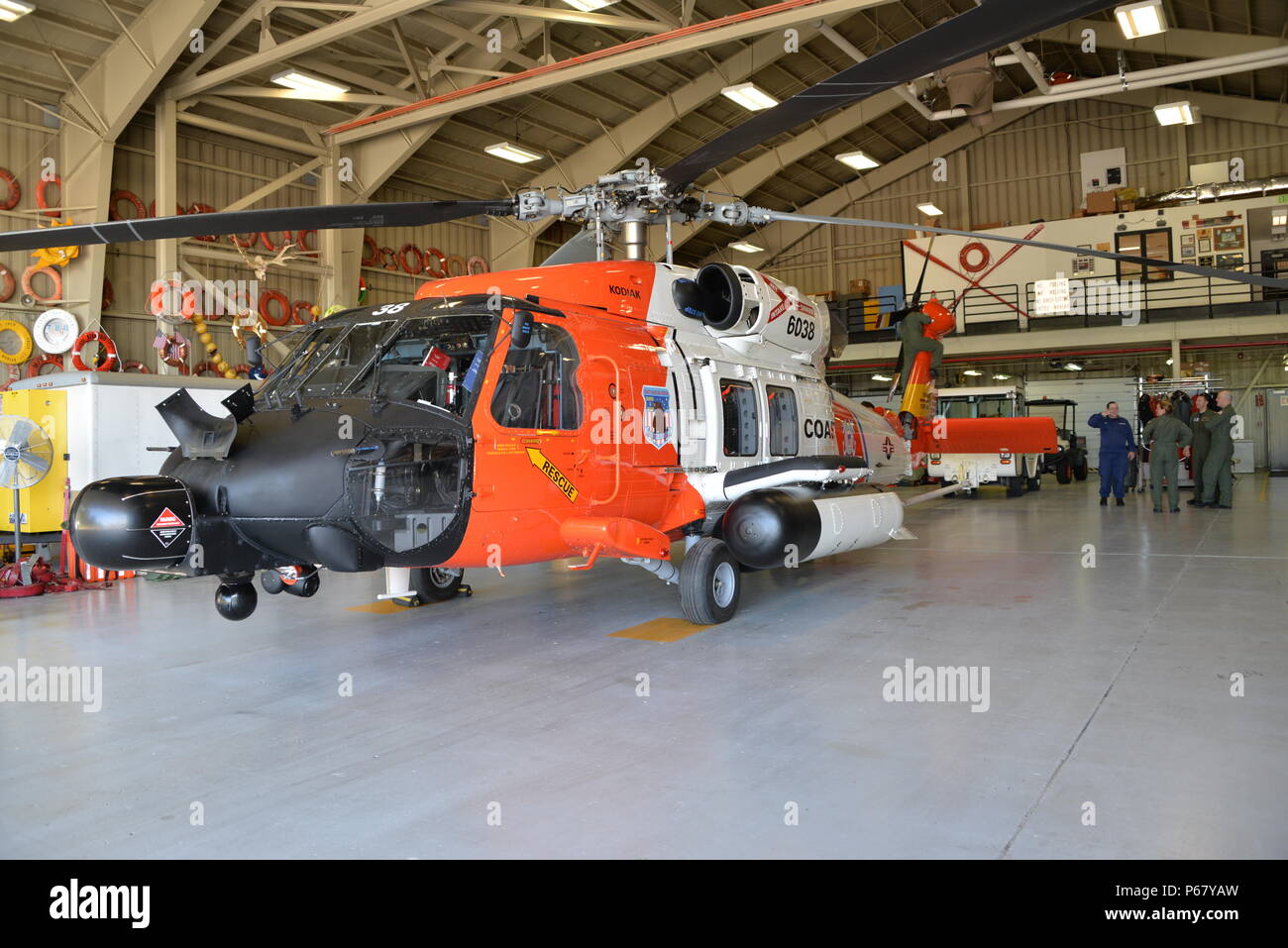 A Coast Guard MH60 Jayhawk helicopter stands ready for deployment in