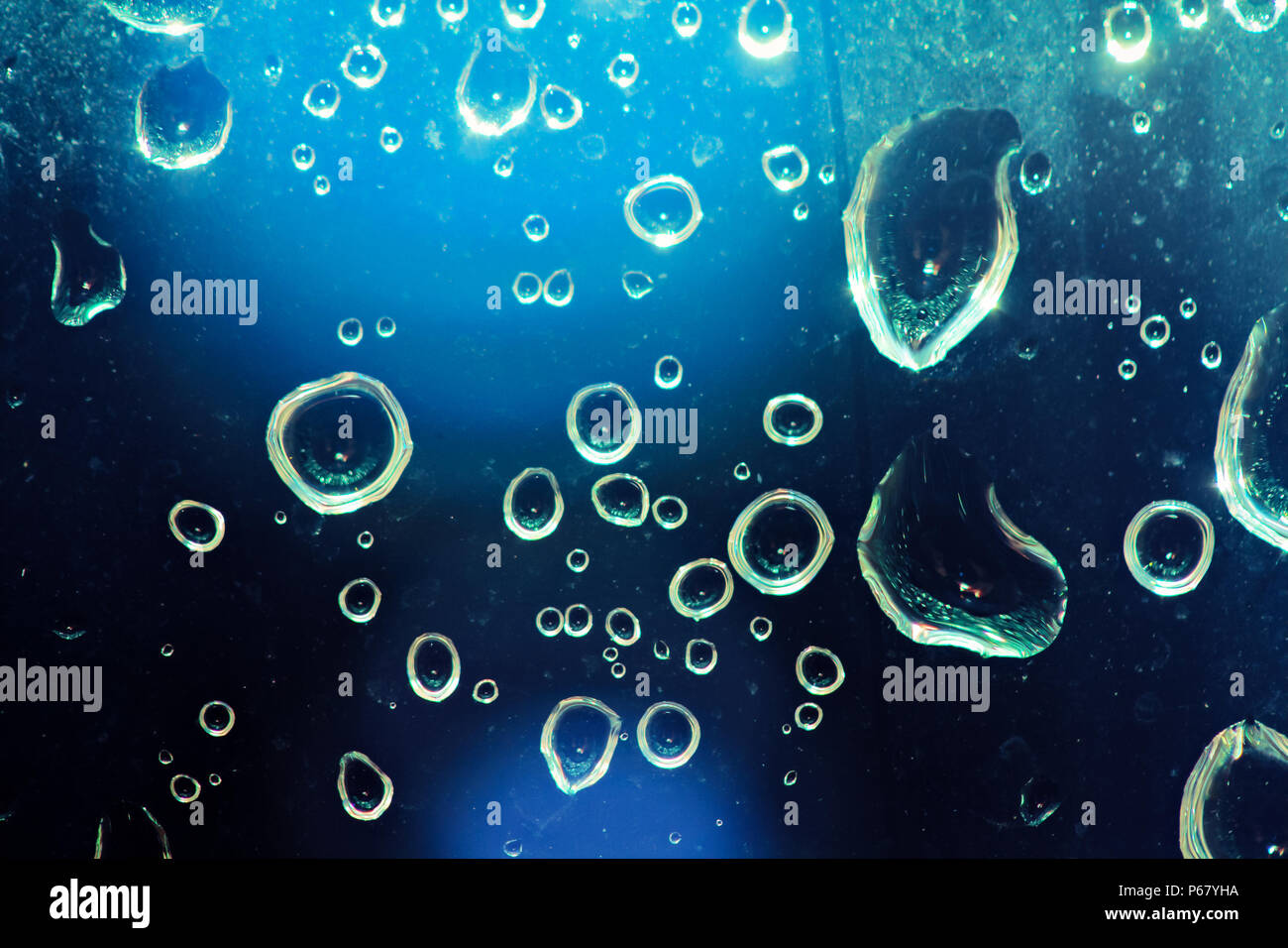 close up of raindrops on a window looking like irfilled bubbles under water Stock Photo