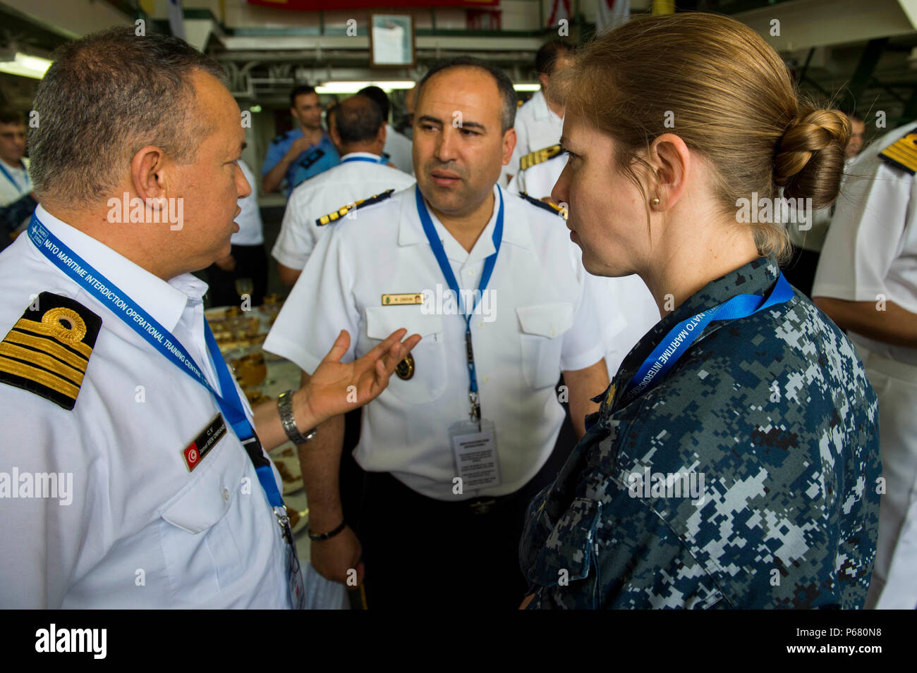 160520-N-AX546-100 SOUDA BAY, Greece (May 20, 2016) Lt. Cmdr. Kelleigh Cunningham, from Fryburg, Pennsylvania speaks with Moroccan Naval officers aboard the Moroccan Frigate Mohammed V, during a partner engagement, May 20. Phoenix Express is a U.S Africa Command-sponsored multinational maritime exercise designed to increase maritime safety and security in the Mediterranean. (U.S. Navy photo by Mass Communication Specialist 1st Class Sean Spratt/Released) Stock Photo