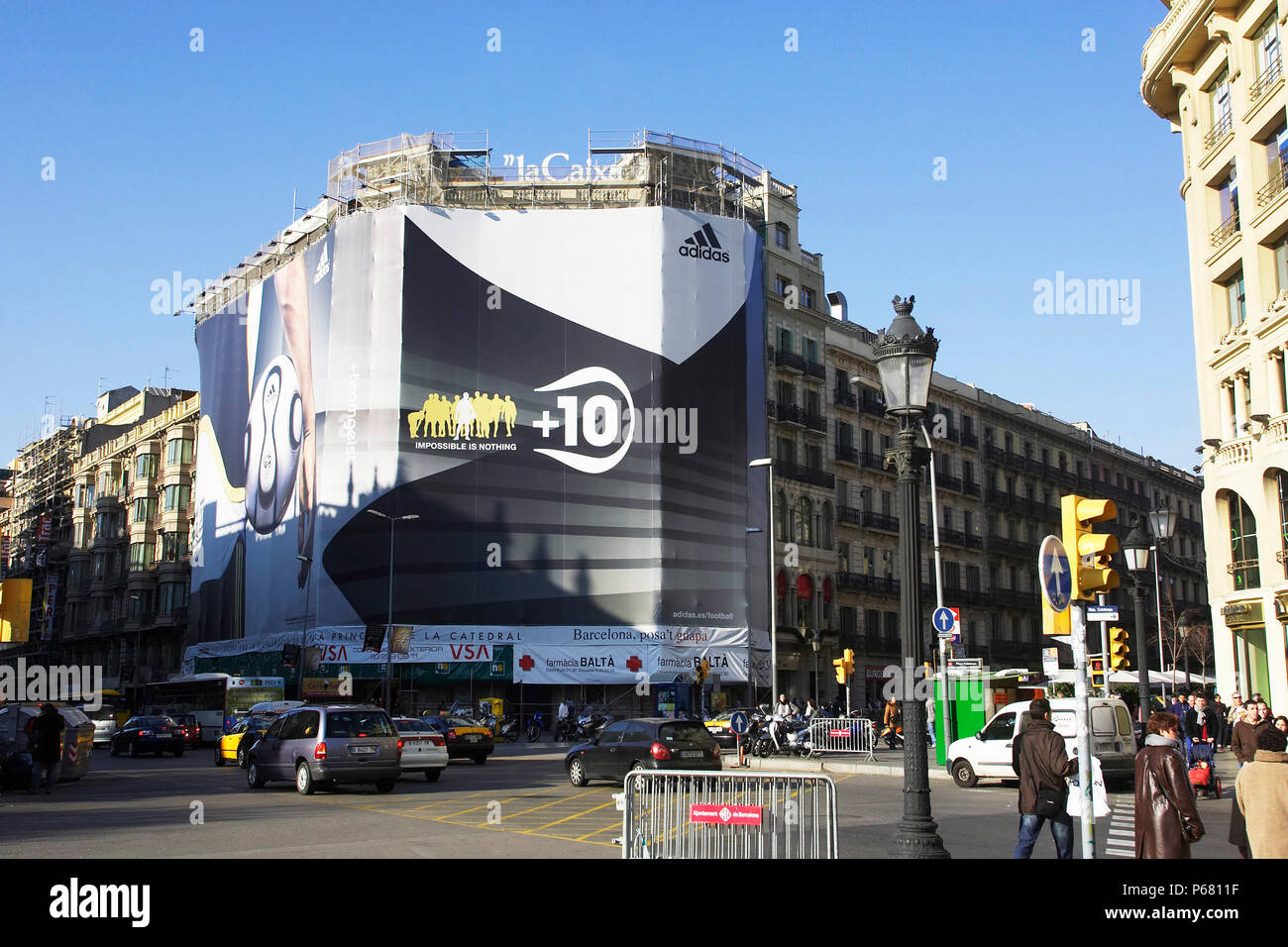 Large advertising hoarding covering a building under refurbishment, La  Rambla, Barcelona, Spain Stock Photo - Alamy