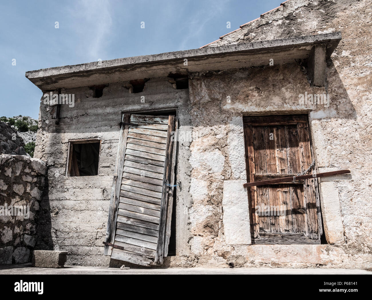 A crooked ramshackle hut serves as a holiday home in this small town near Paklenica National Park, Croatia. Stock Photo