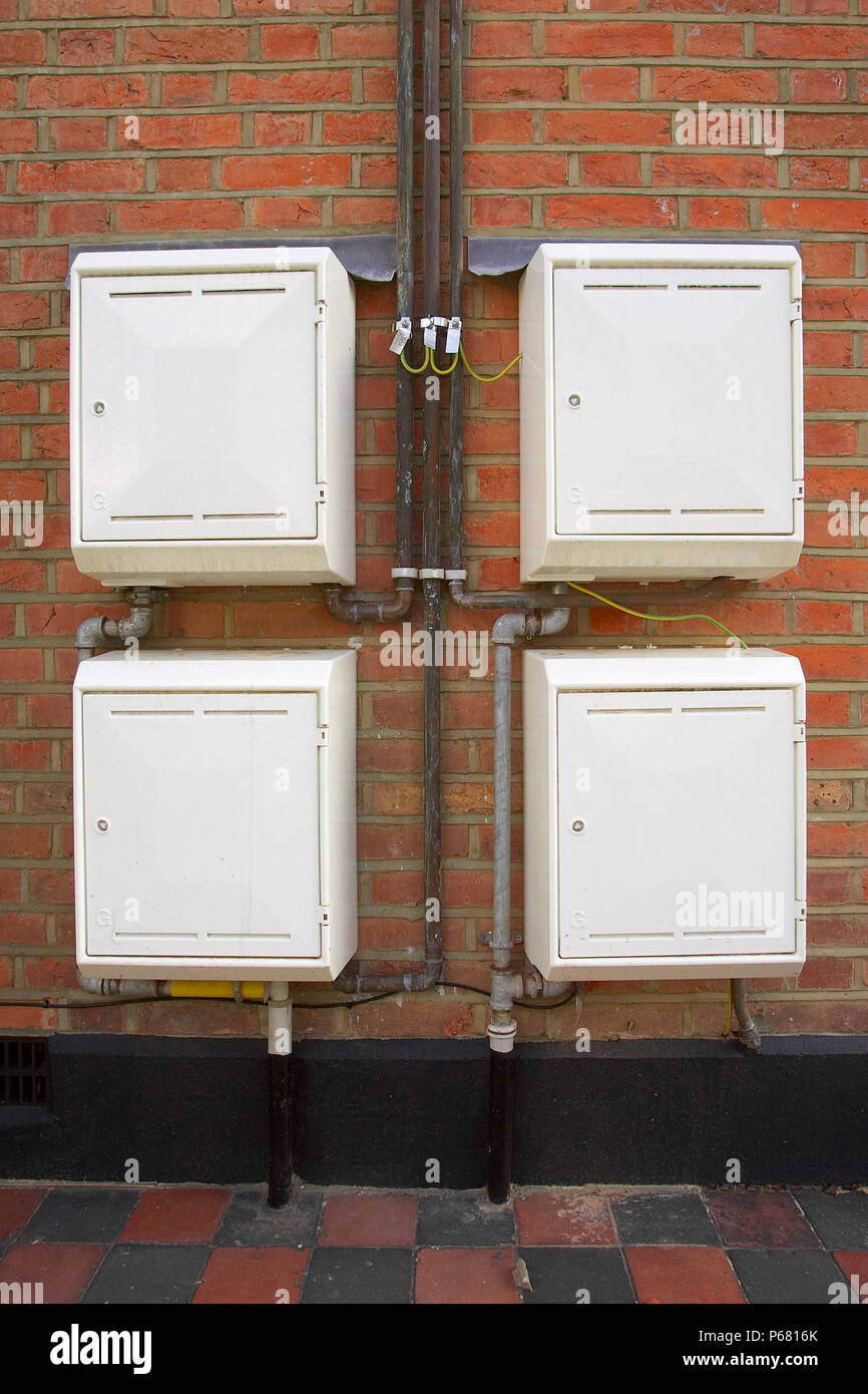 Four gas meter cupboards outside a private house. Stock Photo