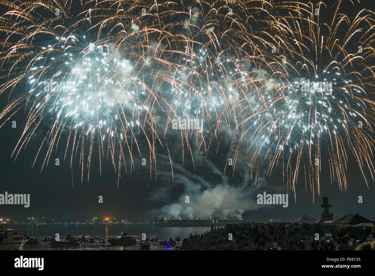 Pyrotechnics explode in the skies over English Bay during an annual fireworks competition in Vancouver, British Columbia. Stock Photo