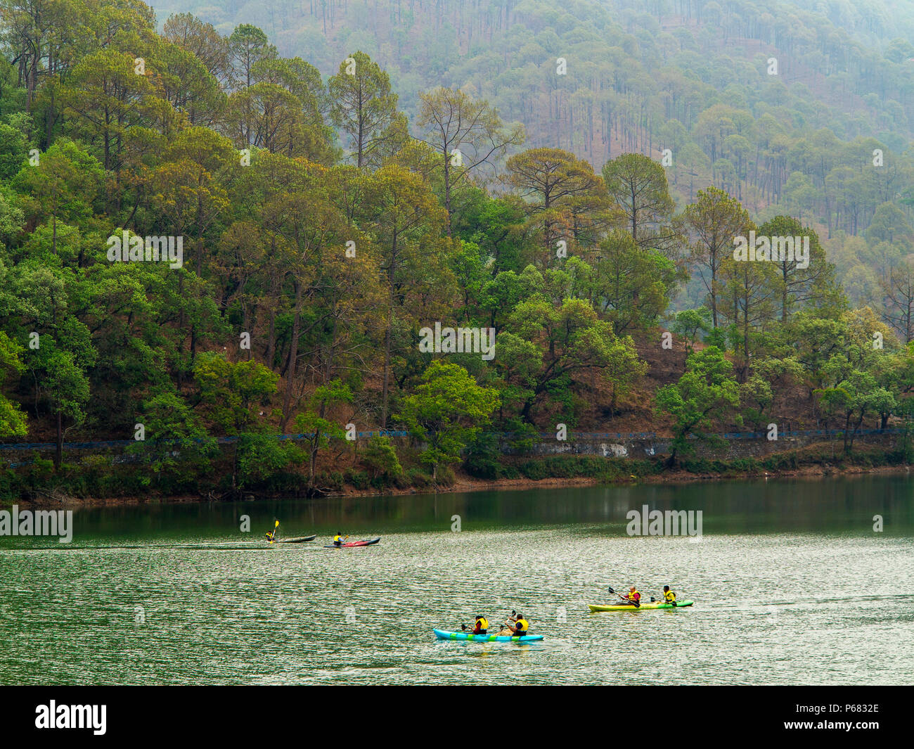 Rowers at Sattal Lake one of the tourist attractions near Nainital, Uttarakhand, India Stock Photo