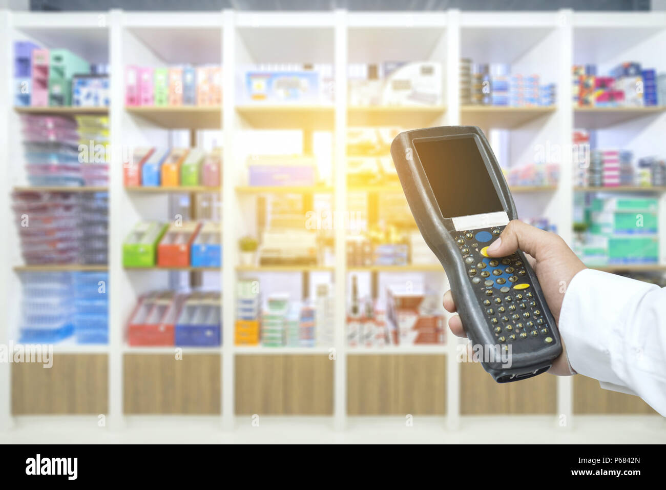 Worker checking and scanning package by tablet handheld in warehouse, Selective focus Stock Photo