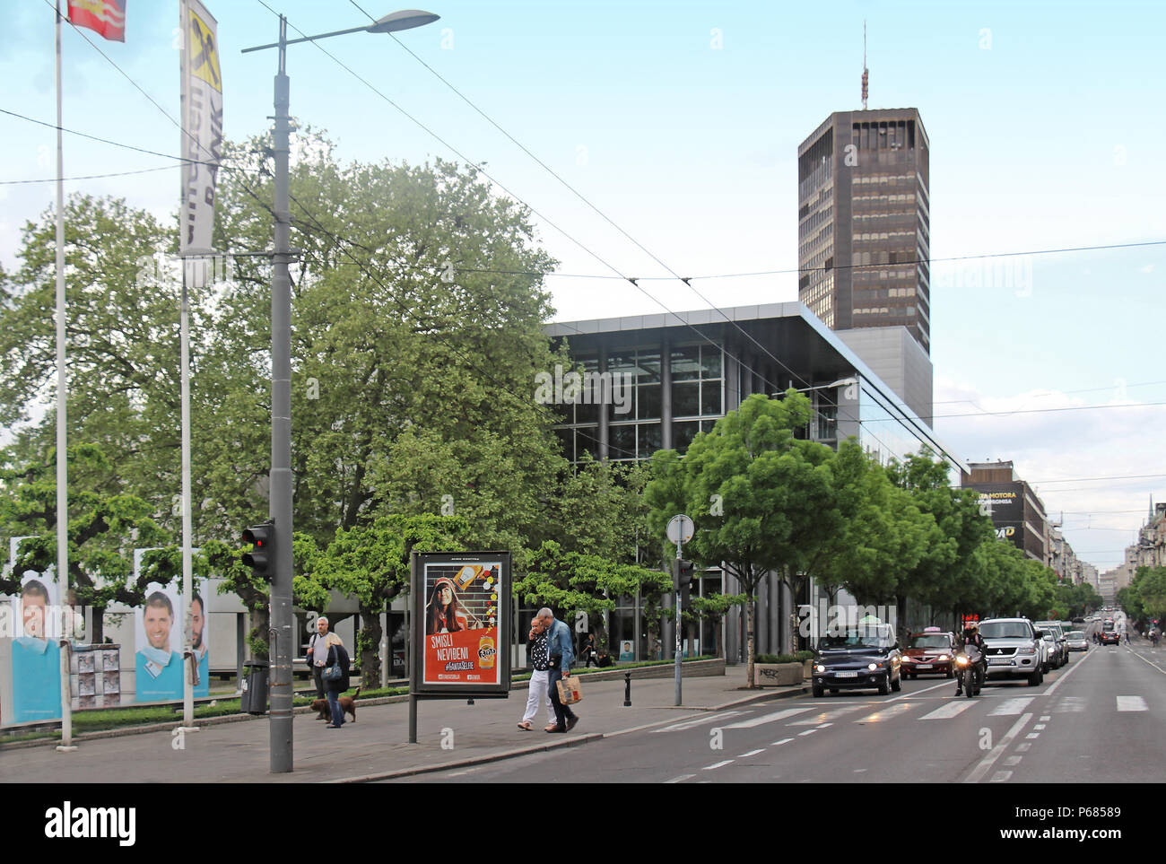 Large central Belgrade street Kralja Milana with tall skyscraper Belgrade Palace in the back and Yugoslav Drama Theatre building on the side. Stock Photo