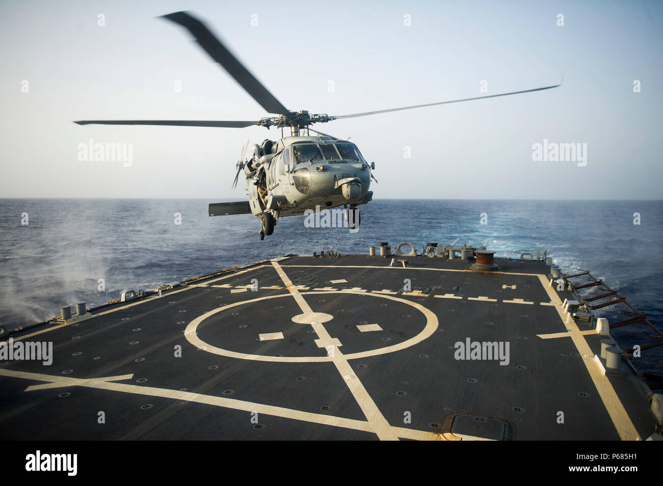 160526-N-VE959-134 GULF OF ADEN (May 26, 2016) An MH-60S Sea Hawk helicopter, assigned to the 'Night Dippers' of Helicopter Sea Combat Squadron (HSC) 5, lands on the flight deck of guided-missile destroyer USS Gonzalez (DDG 66). Gonzalez is deployed as part of the Harry S. Truman Carrier Strike Group in support of Operation Inherent Resolve, maritime security operations and theater security cooperation efforts in the U.S. 5th Fleet area of operations. (U.S. Navy photo by Mass Communication Specialist 3rd Class Pasquale Sena/Released) Stock Photo