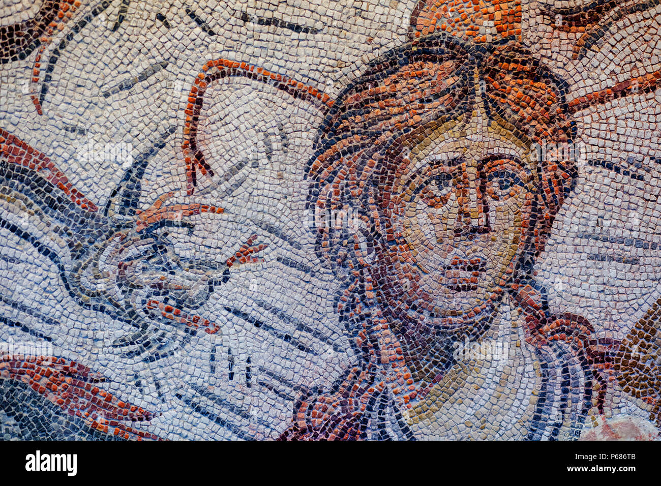 Jaen, Spain - December 29th, 2017: Roman Mosaic depicting sea-goddess Tethys at Jaen Museum. Fragment detail Stock Photo