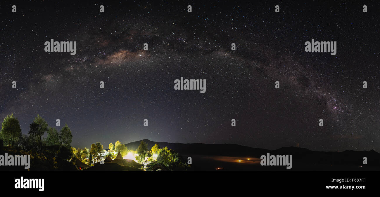 Panoramic milky way and starry sky at night in Semeru National Park, Indonesia Stock Photo