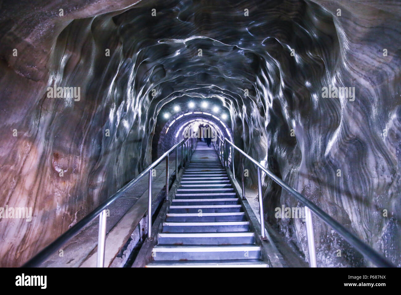 Illuminated underground entrance of Turda salt mine, Cluj, Romania Stock Photo
