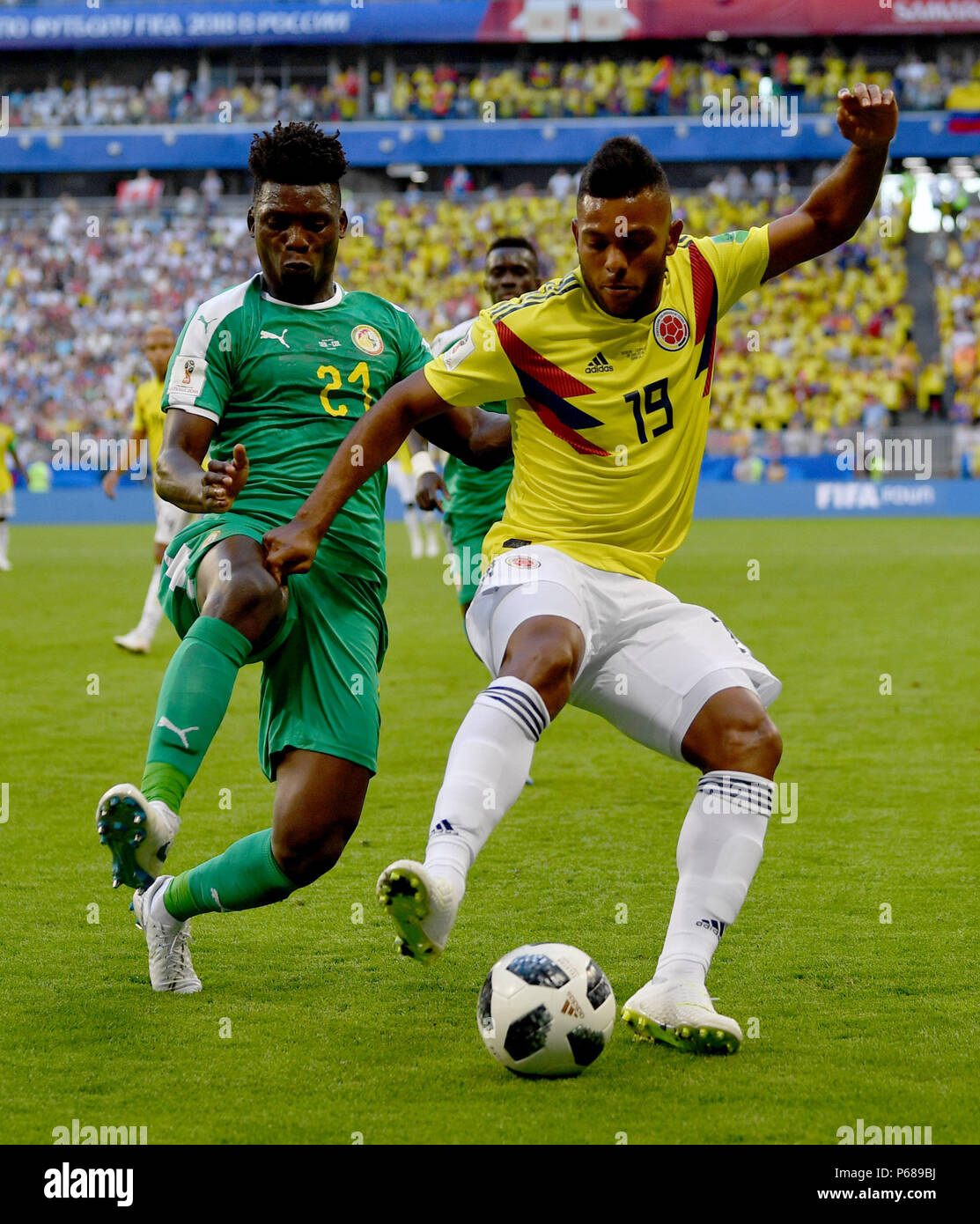 Samara, Russia. 28th June, 2018. Miguel Borja (R) of Colombia vies with Lamine Gassama of Senegal during the 2018 FIFA World Cup Group H match between Colombia and Senegal in Samara, Russia, June 28, 2018. Colombia won 1-0 and advanced to the round of 16. Credit: Chen Cheng/Xinhua/Alamy Live News Stock Photo
