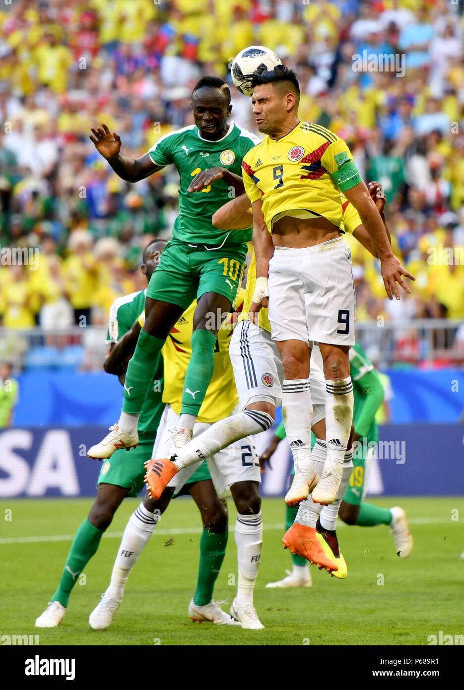Samara, Russia. 28th June, 2018. Radamel Falcao (R) of Colombia competes for a header with Sadio Mane of Senegal during the 2018 FIFA World Cup Group H match between Colombia and Senegal in Samara, Russia, June 28, 2018. Credit: Liu Dawei/Xinhua/Alamy Live News Stock Photo