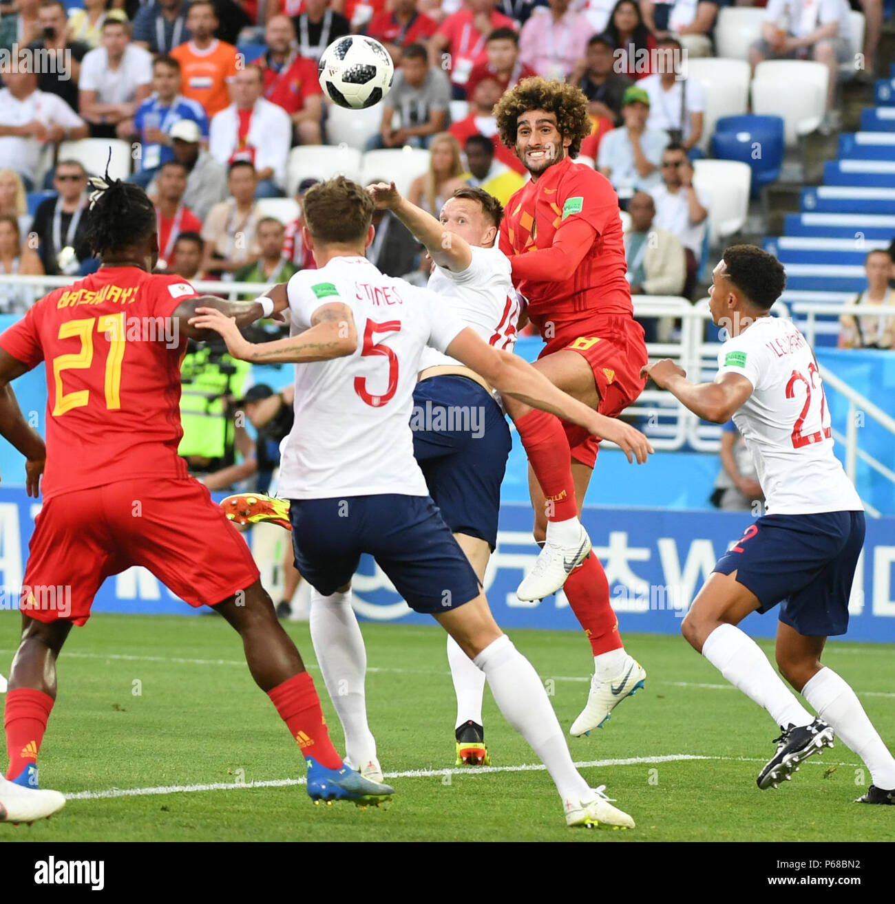 Kaliningrad, Russia. 28th June, 2018. Phil Jones (C) of England vies with Marouane Fellaini (2nd R) of Belgium during the 2018 FIFA World Cup Group G match between England and Belgium in Kaliningrad, Russia, June 28, 2018. Credit: Du Yu/Xinhua/Alamy Live News Stock Photo