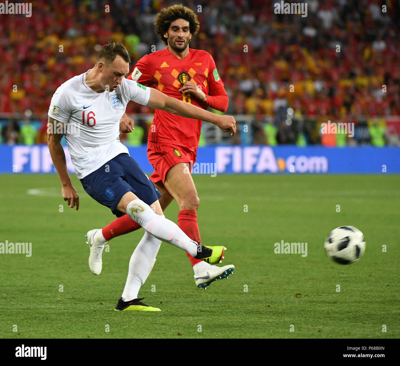 Kaliningrad, Russia. 28th June, 2018. Phil Jones (L) of England vies with Marouane Fellaini of Belgium during the 2018 FIFA World Cup Group G match between England and Belgium in Kaliningrad, Russia, June 28, 2018. Credit: Du Yu/Xinhua/Alamy Live News Stock Photo