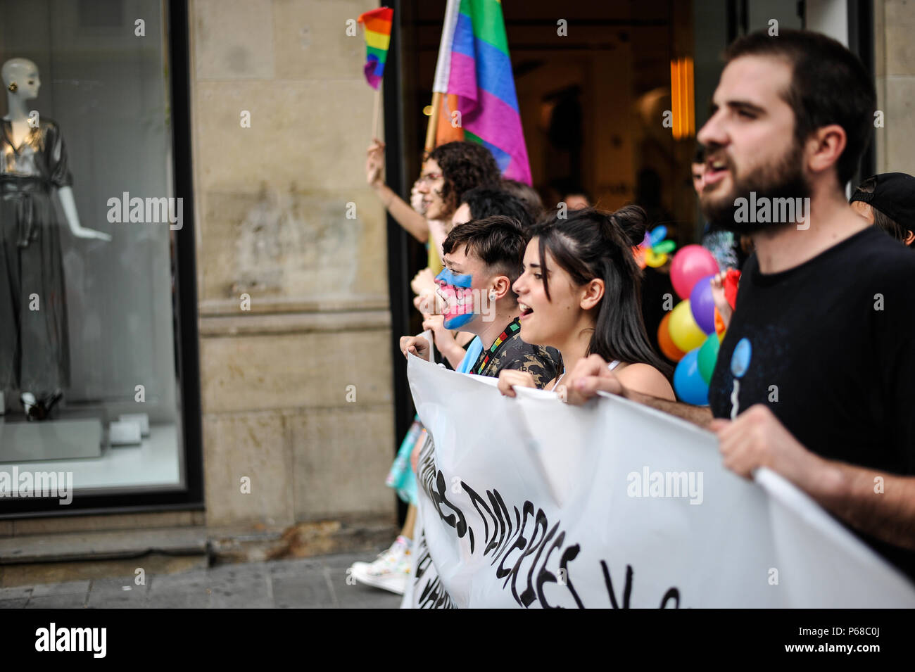 Pamplona, Spain. 28th June, 2018. Participants in the gay pride parade waves flags as thousands of people rally for LGBTQ+ rights in Pamplona, Spain on June 28, 2018 to mark the start of Pride weekend in the city. Credit: Mikel Cia Da Riva/Alamy Live News Stock Photo