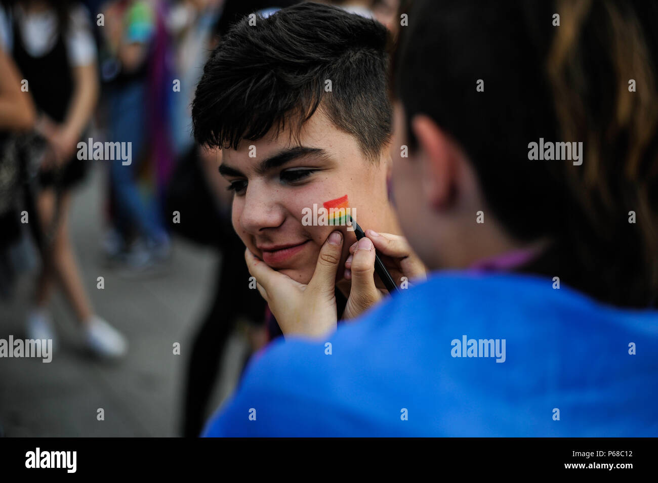 Pamplona, Spain. 28th June, 2018. Participants in the gay pride parade waves flags as thousands of people rally for LGBTQ+ rights in Pamplona, Spain on June 28, 2018 to mark the start of Pride weekend in the city. Credit: Mikel Cia Da Riva/Alamy Live News Stock Photo