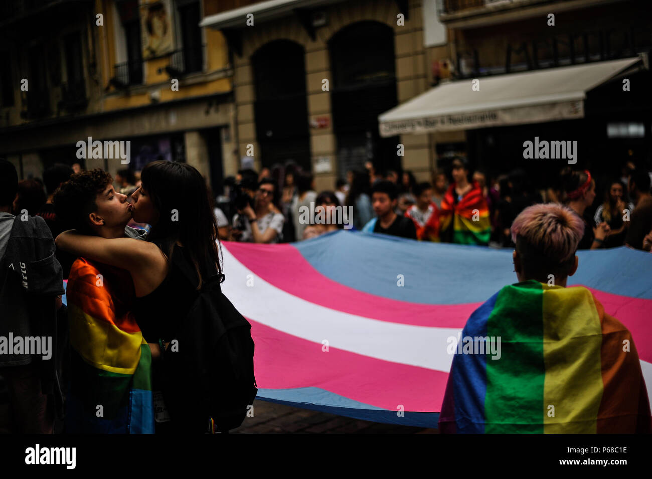 Pamplona, Spain. 28th June, 2018. Participants in the gay pride parade waves flags as thousands of people rally for LGBTQ+ rights in Pamplona, Spain on June 28, 2018 to mark the start of Pride weekend in the city. Credit: Mikel Cia Da Riva/Alamy Live News Stock Photo