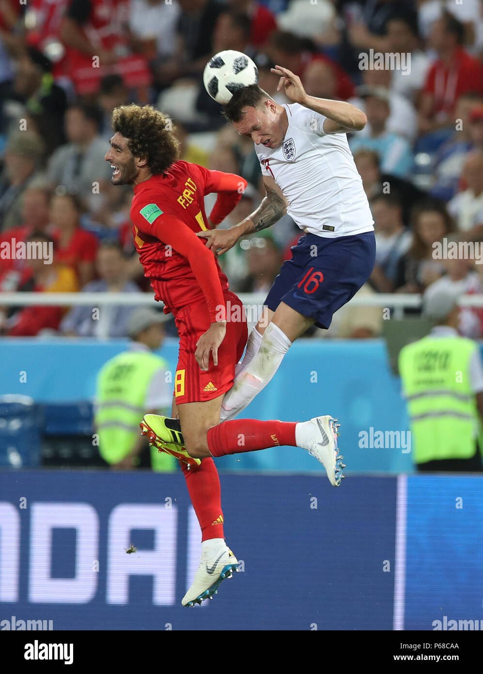 Kaliningrad, Russia. 28th June, 2018. Phil Jones (R) of England competes for a header with Marouane Fellaini of Belgium during the 2018 FIFA World Cup Group G match between England and Belgium in Kaliningrad, Russia, June 28, 2018. Credit: Xu Zijian/Xinhua/Alamy Live News Stock Photo
