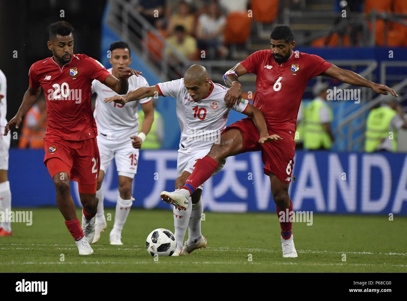Saransk, Russia. 28th June, 2018. Gabriel Gomez (1st R) of Panama vies with Wahbi Khazri (2nd R) of Tunisia during the 2018 FIFA World Cup Group G match between Panama and Tunisia in Saransk, Russia, June 28, 2018. Tunisia won 2-1. Credit: He Canling/Xinhua/Alamy Live News Stock Photo
