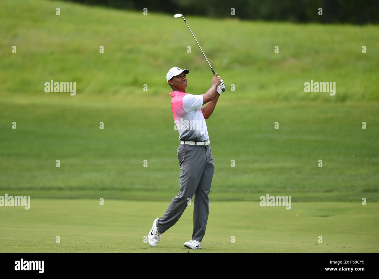Potomac MD, USA. 28th June, 2018. Tiger Woods (USA) hits his approach shot from the center of the fairway at the second hole during the opening round at the 2018 Quicken Loans National at the Tournament Players Club in Potomac MD. Credit: Cal Sport Media/Alamy Live News Stock Photo