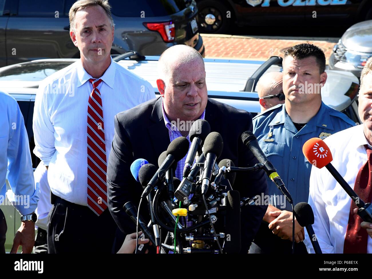 Annapolis, USA. 28th June, 2018. Maryland Governor Larry Hogan (C) speaks to the media near the scene of a mass shooting in Annapolis, the capital city of eastern U.S. state Maryland, on June 28, 2018. Five people were killed on Thursday afternoon with several 'gravely injured' in a mass shooting at local daily newspaper Capital Gazette in Annapolis, police said. Credit: Yang Chenglin/Xinhua/Alamy Live News Stock Photo